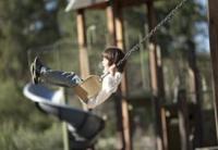 Child on a swing at the playground